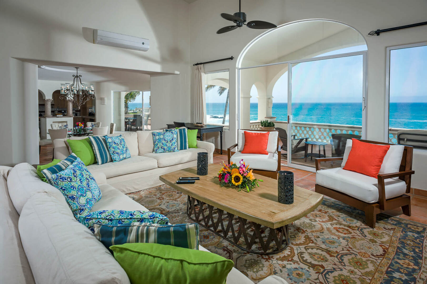 Large sliding glass doors and windows allow plenty of natural light to filter into the open-concept living and dining area